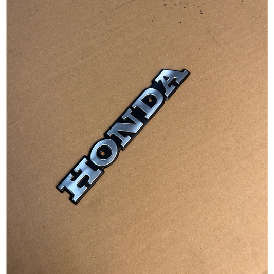 Honda plate with two holes for screws - new without packaging 